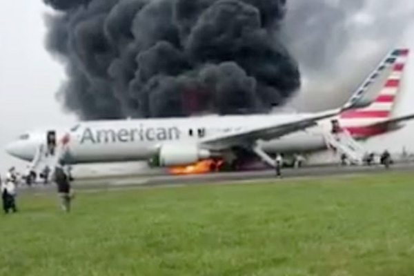 American Airlines plane catches fire on takeoff at Chicago airport!