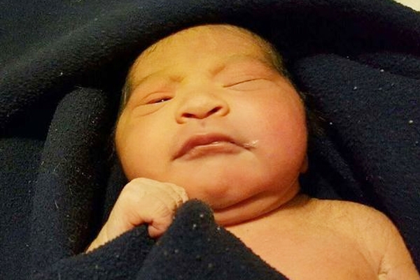 Newborn girl-child left abandoned in the house backyard